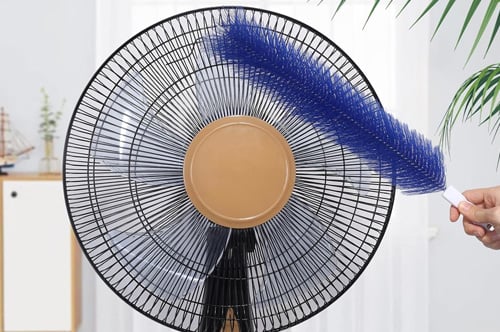 Blue flexible brush curving around the fan grille